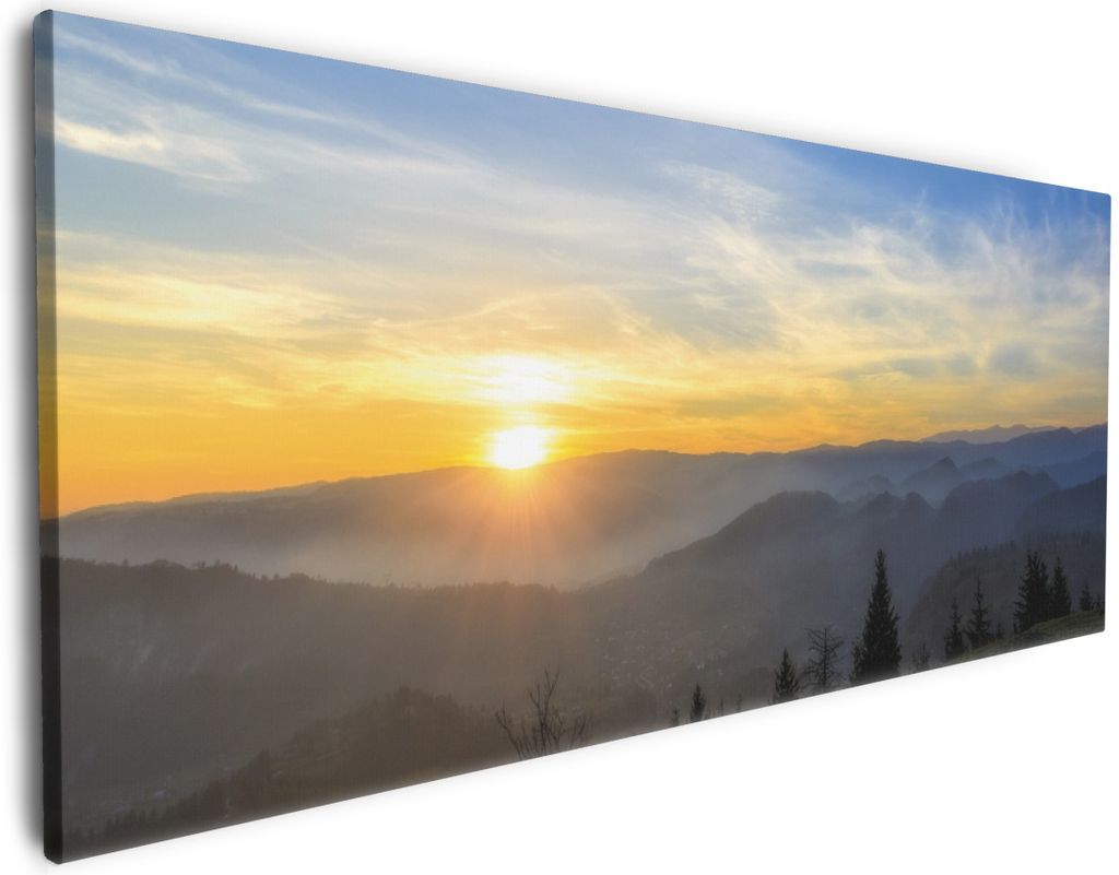 Wallario Premium Leinwandbild Sonnenaufgang über dem Schwarzwald in Größe 60 x 150 cm