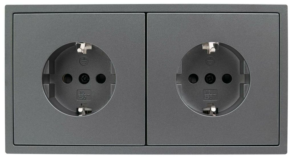 A close-up studio shot of a double electrical outlet.