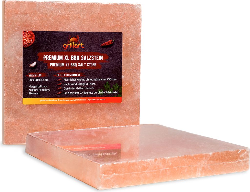 Two pink Himalayan salt blocks for grilling, one with a label.
