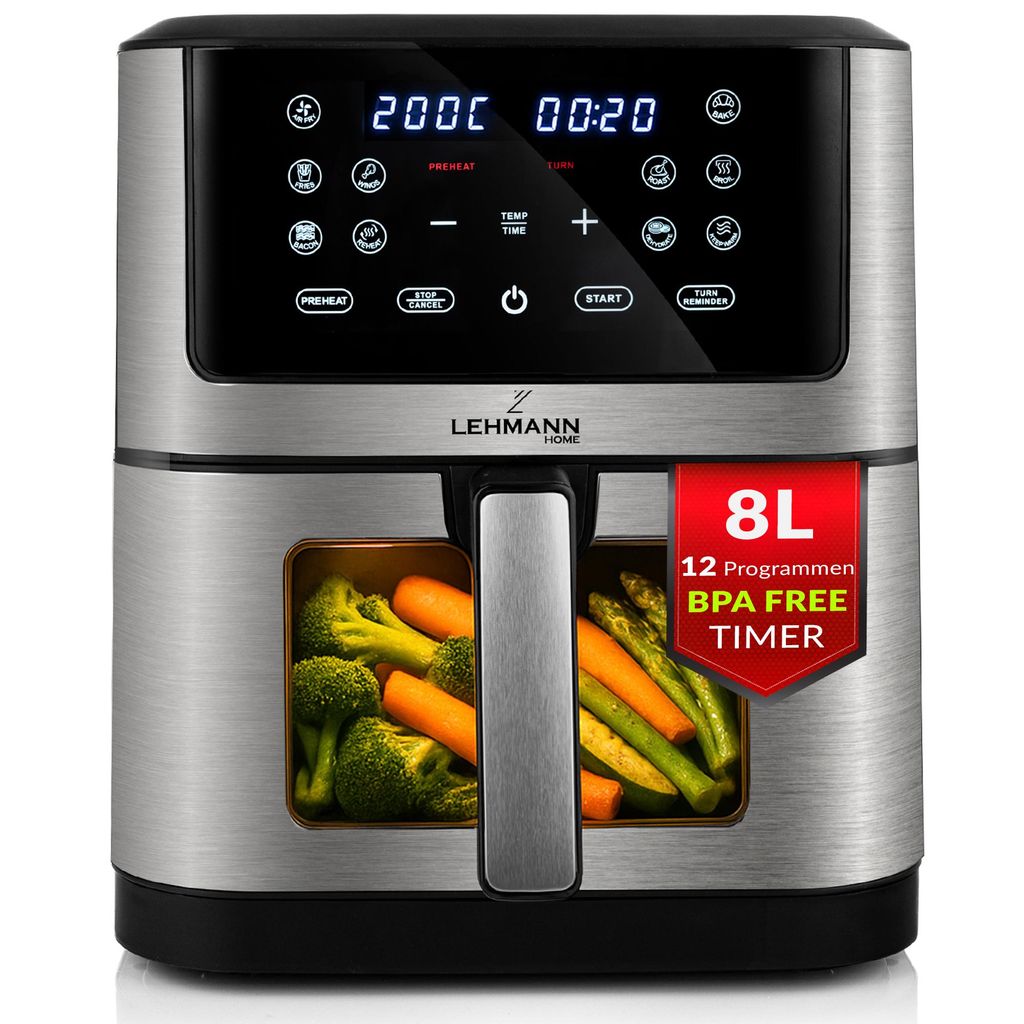 A silver and black air fryer with a transparent window showing vegetables inside, placed on a white background.