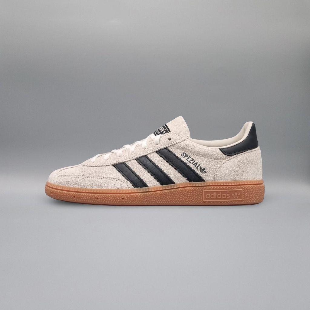 A side view of an Adidas Handball Spezial shoe against a plain gray background.