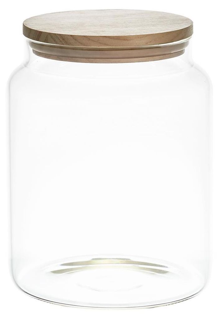 A clear glass storage jar with a wooden lid.
