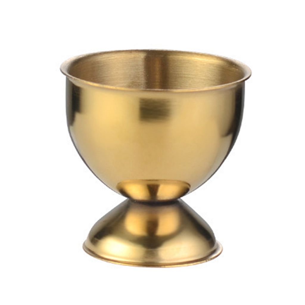 A golden egg cup on a white background.