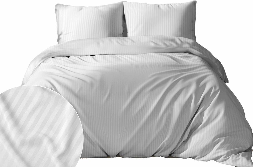 A white satin striped duvet cover and two pillowcases are neatly arranged on a bed.