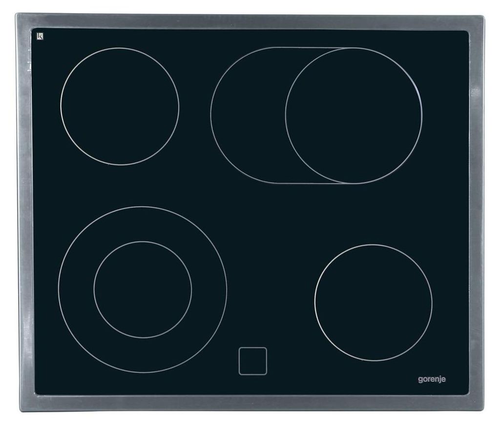 A top-down view of a black electric stovetop with silver trim.