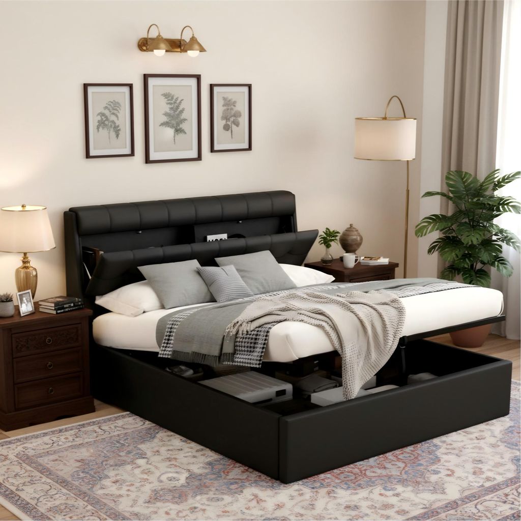 A bedroom scene with a black upholstered bed frame.