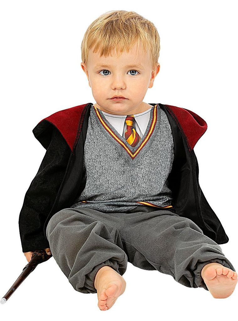 A baby dressed in a Harry Potter costume, sitting down and holding a wand.