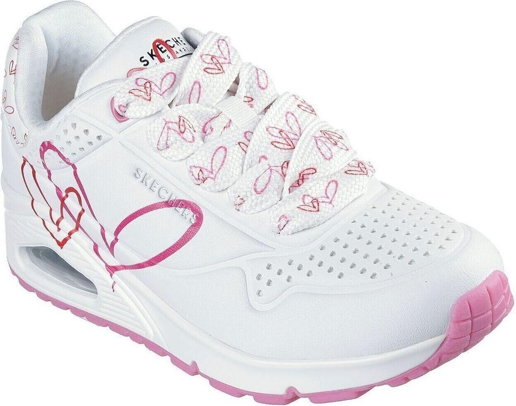 A white Skechers sneaker with pink heart accents and laces.