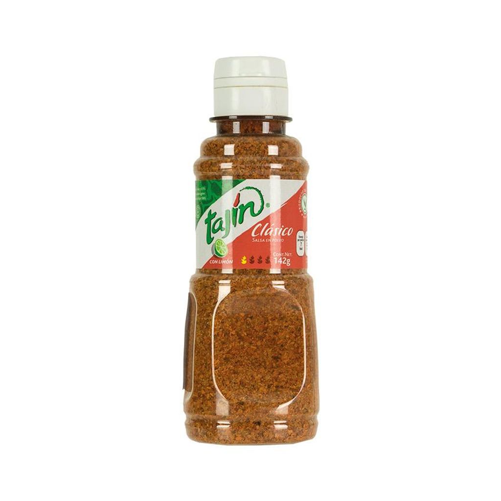 A bottle of Tajin Clásico seasoning powder against a white background.
