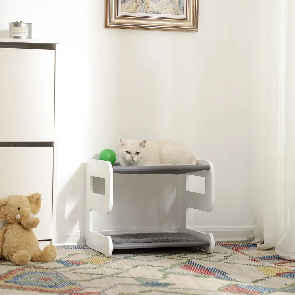 Couchage pour chat gris blanc forme de 9 idéal pour petits espaces