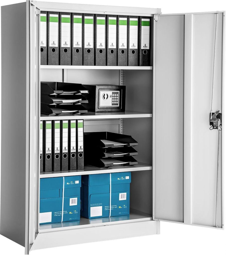 An open metal filing cabinet filled with binders, trays, a small safe, and boxes.