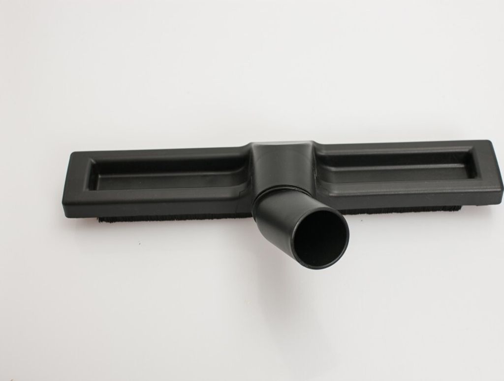 A black vacuum cleaner floor nozzle is shown on a white background.