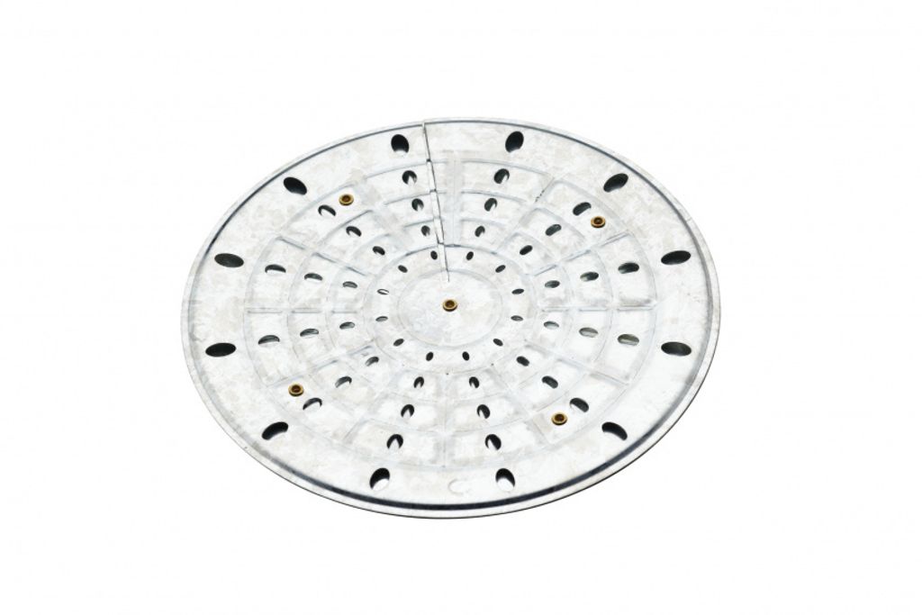 A circular metal heat diffuser with multiple holes and concentric rings, shown from a top-down perspective against a white background.