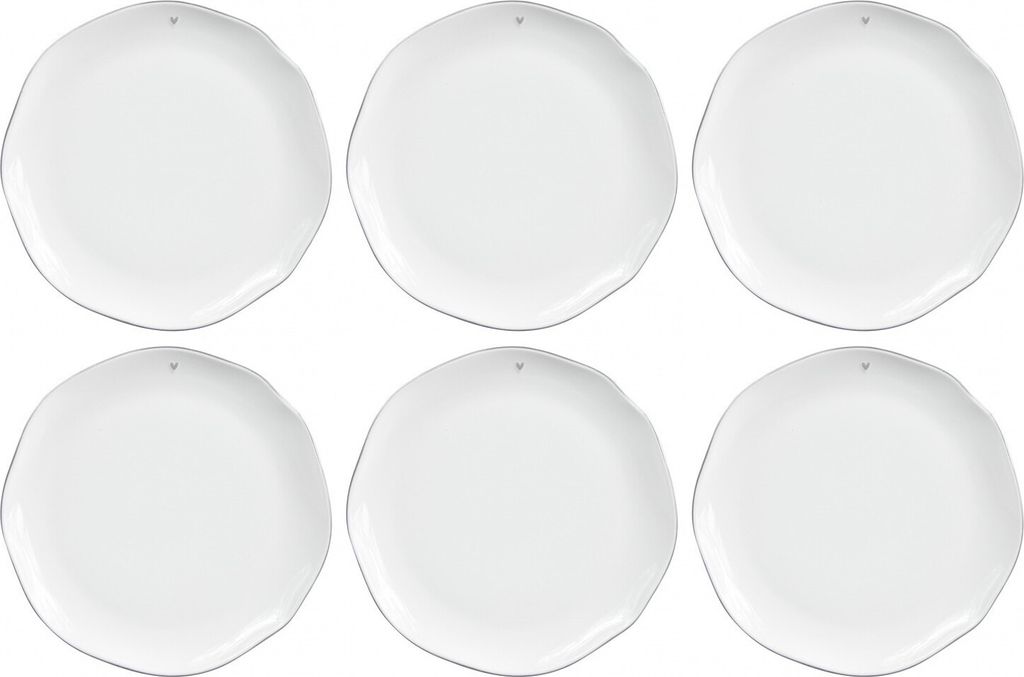 Six white plates arranged in two rows of three.