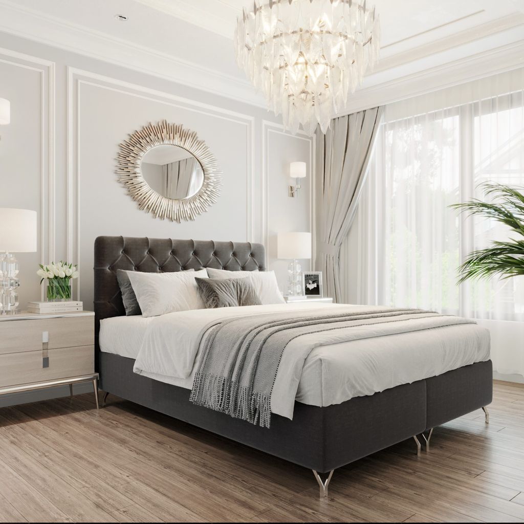 A luxurious bedroom setting featuring a large bed, nightstands, and decorative elements.