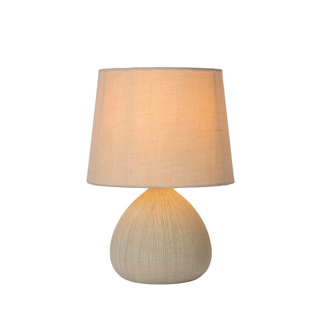 A table lamp with a fabric shade and a textured base.