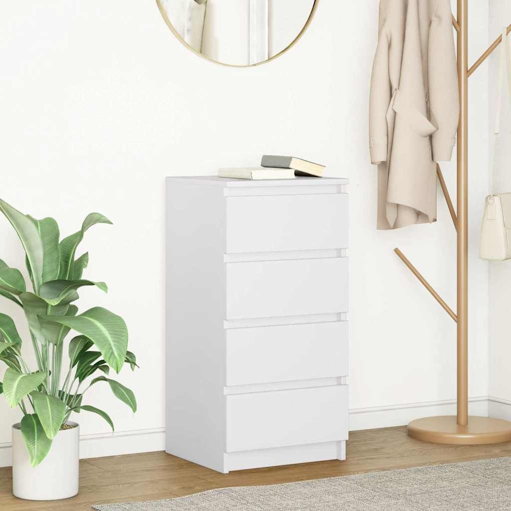 A white chest of drawers with books on top, next to a potted plant and a coat rack with clothes.