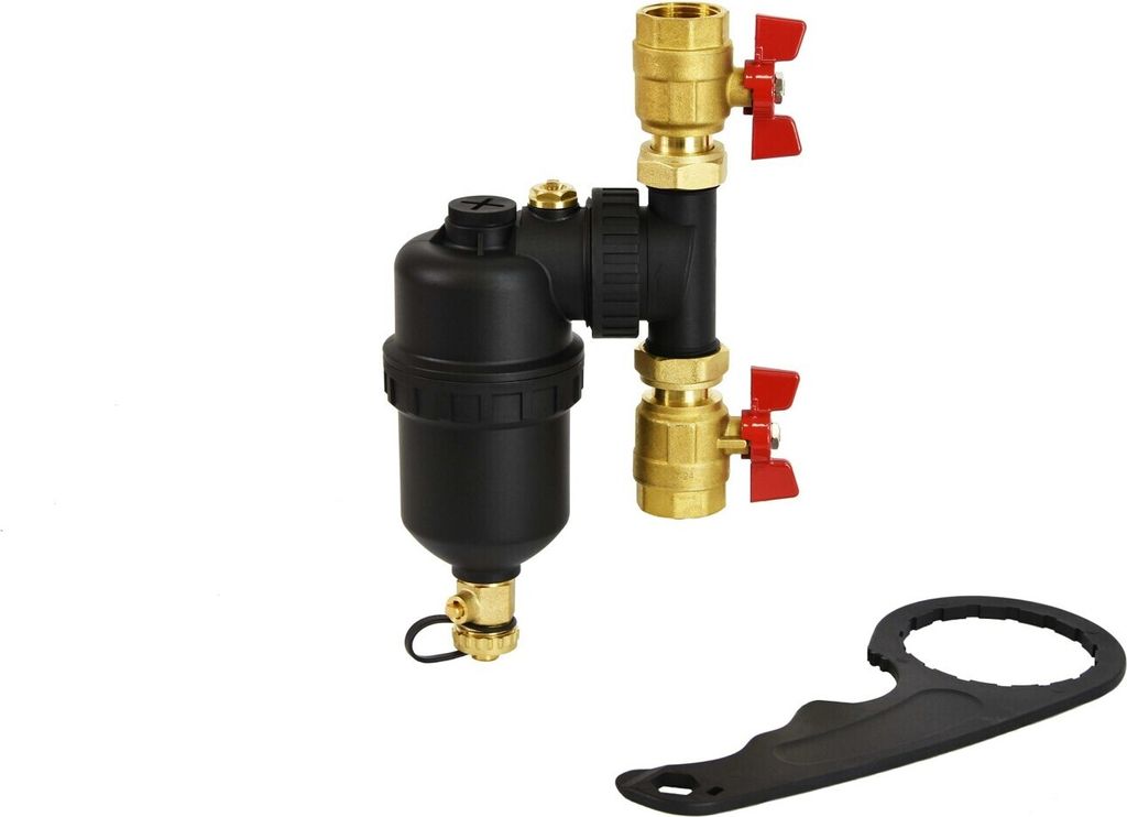 A magnetic sludge separator with brass fittings and red valve handles, along with a black wrench, is displayed against a white background.