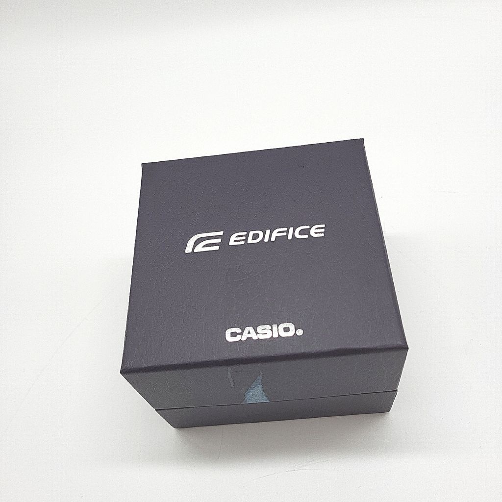 A dark grey box with the brand name 'EDIFICE' and 'CASIO.' printed on it.