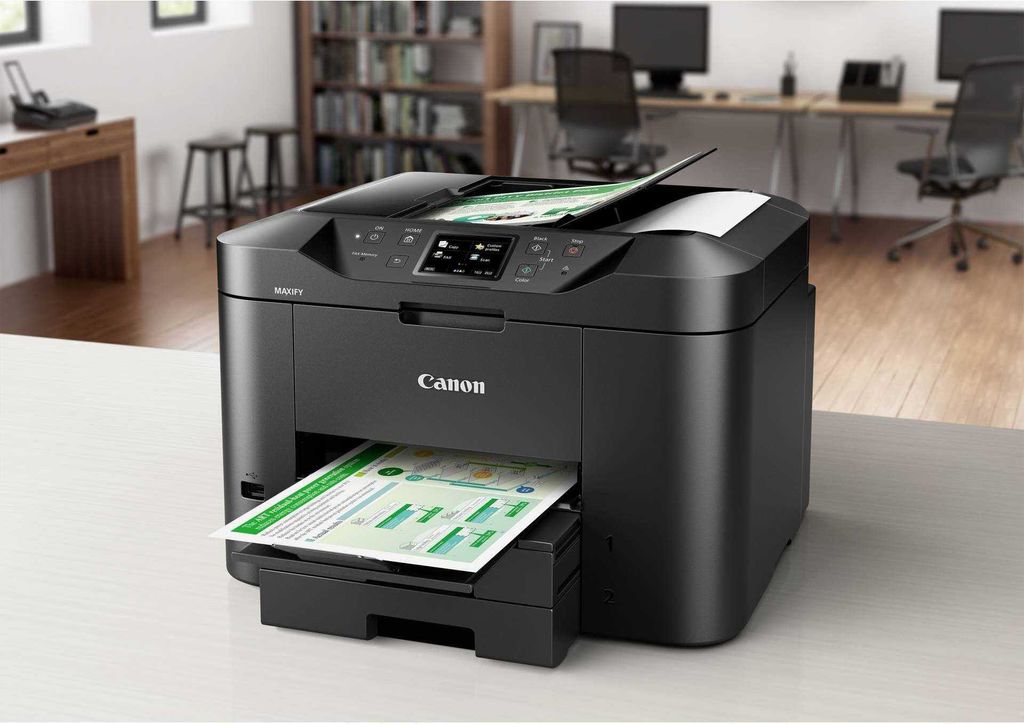 A Canon MAXIFY MB2750 printer is shown in an office setting, printing documents.