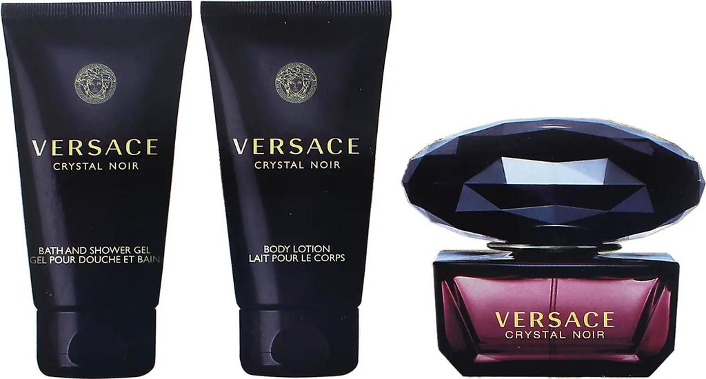 A gift set of Versace Crystal Noir perfume, body lotion, and shower gel.