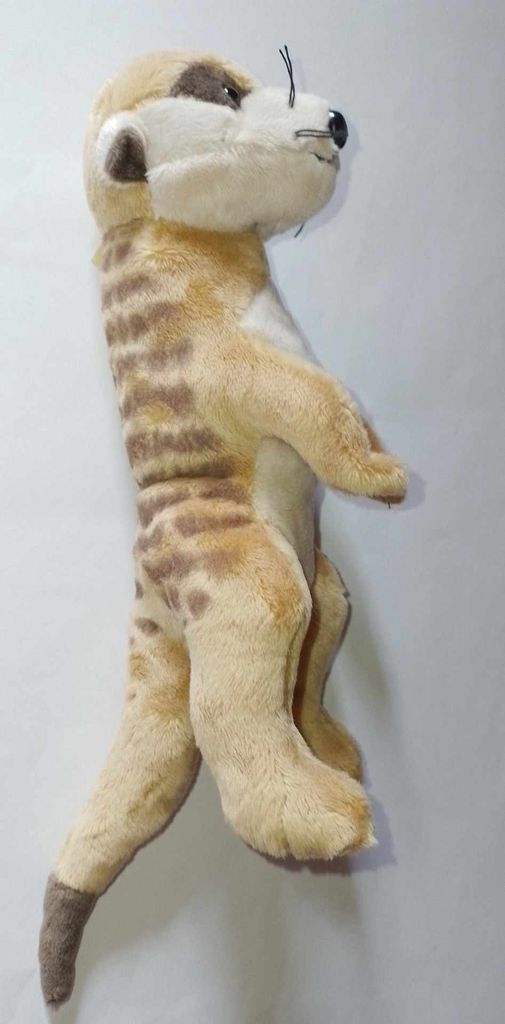 A stuffed meerkat toy standing upright against a plain background.