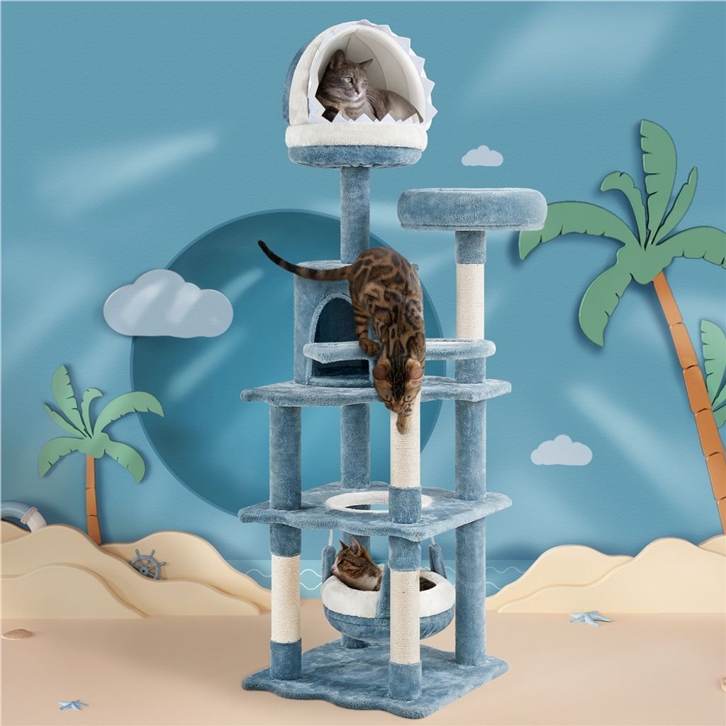 A multi-level cat tree with three cats, set against a beach-themed backdrop with palm trees and clouds.