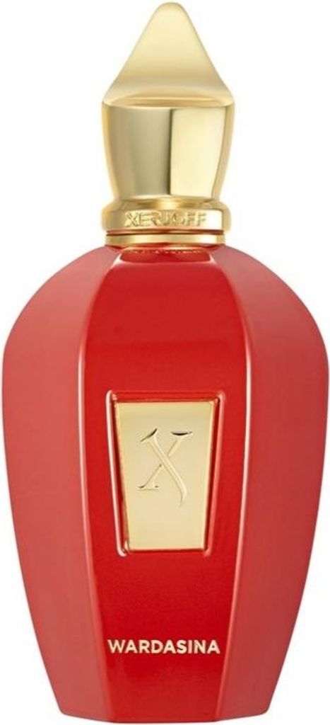 A studio shot of a red and gold perfume bottle.