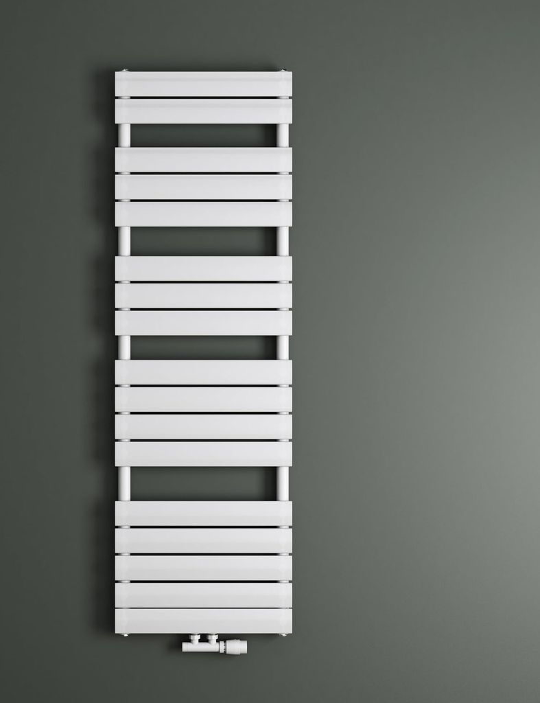 A white radiator is mounted on a gray wall.