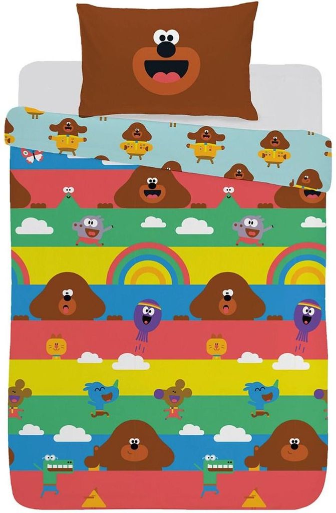 A bedding set with a pillow and duvet cover featuring cartoon characters and colorful stripes.