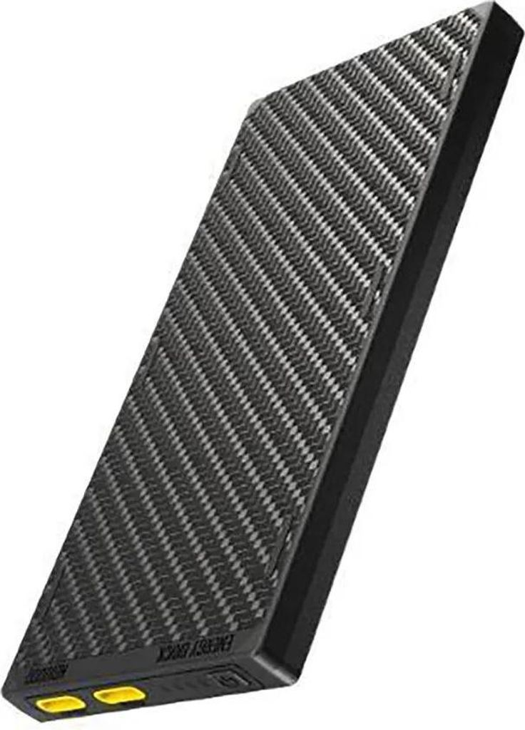 A black and gray power bank with a carbon fiber texture is shown against a white background.