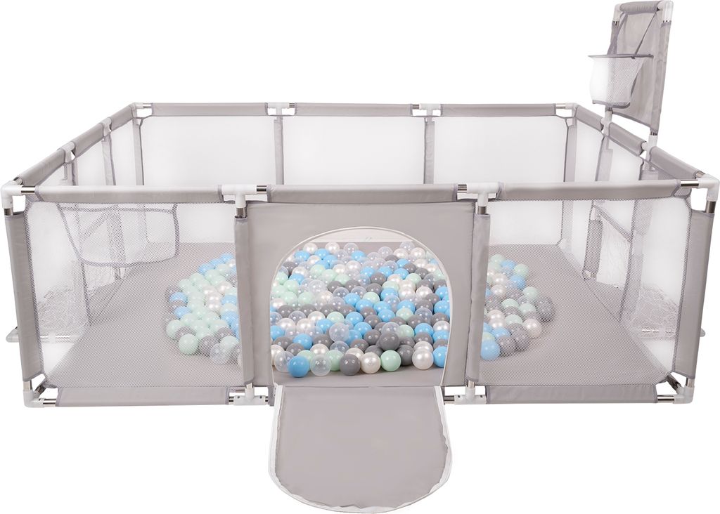 A grey fabric playpen filled with colorful balls, with an arched entrance and a basketball hoop attachment.