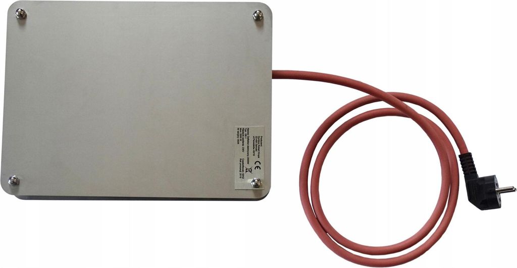 A silver rectangular device with a red power cord and plug is shown on a white background.