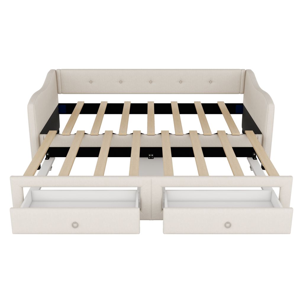 A beige daybed with two drawers pulled out, showing the wooden slats of the mattress support.