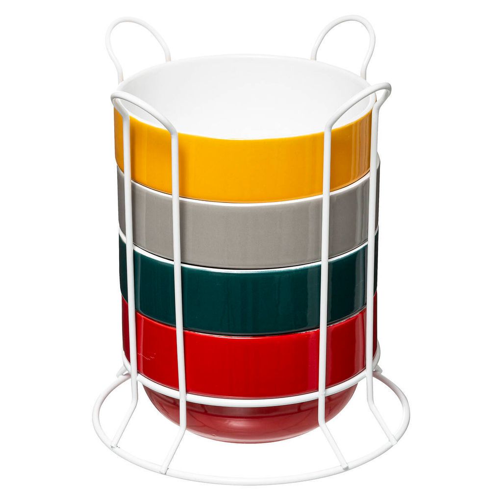 A stack of five colorful bowls in a white wire rack.