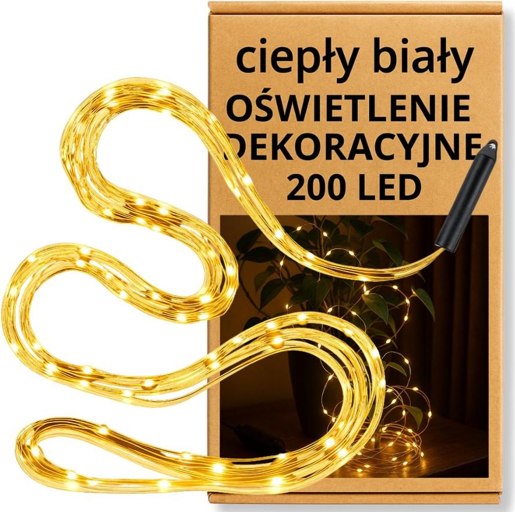 A product box with a string of LED lights draped over it and around a potted plant.