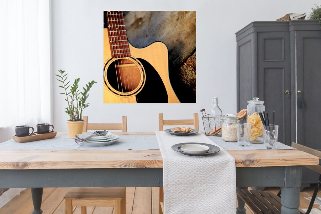 MuchoWow Poster Eine akustische Gitarre auf einem Holzsockel 100x100 cm - Babyzimmer