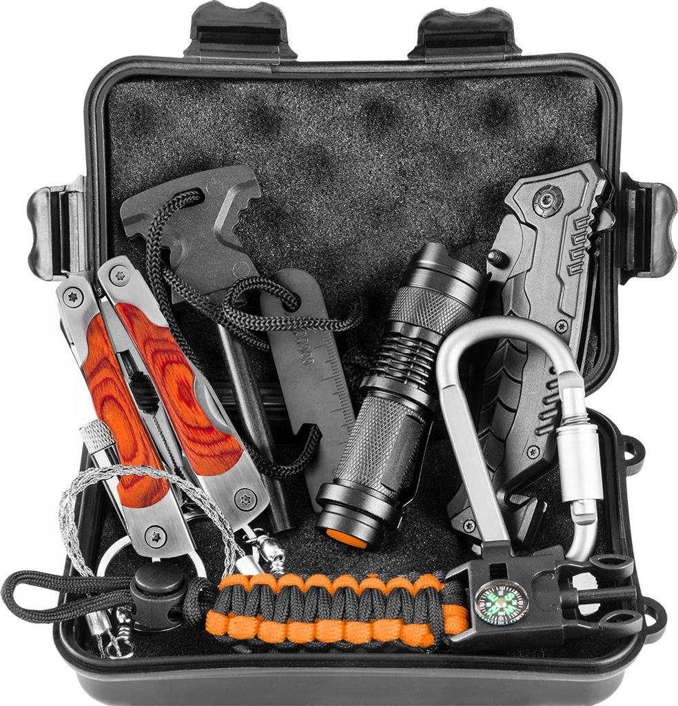 An open survival kit with various tools inside.
