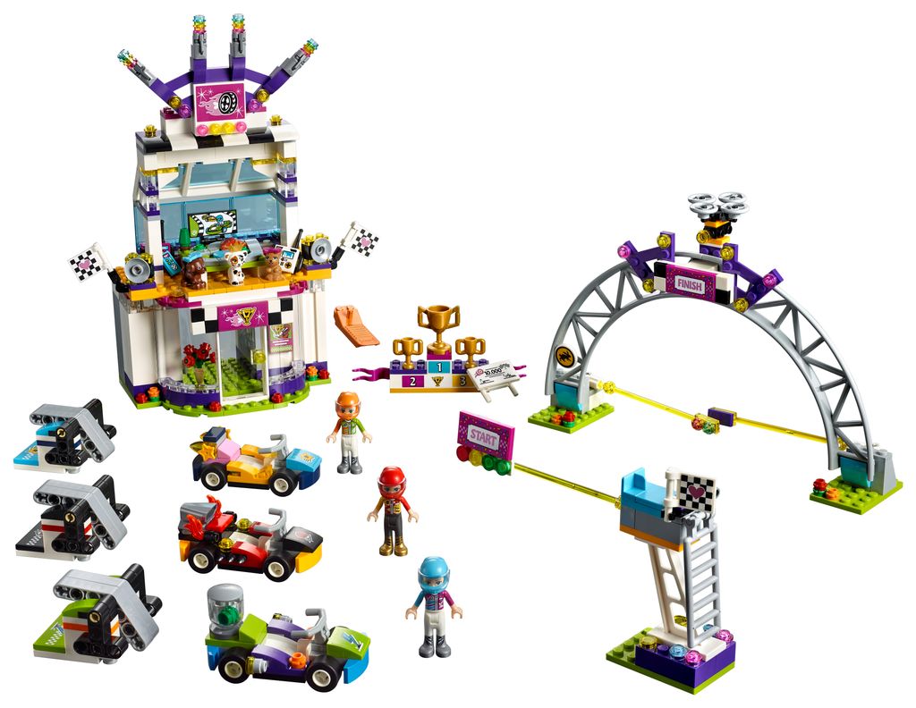 A LEGO Friends racing set with figures, vehicles, and track elements.