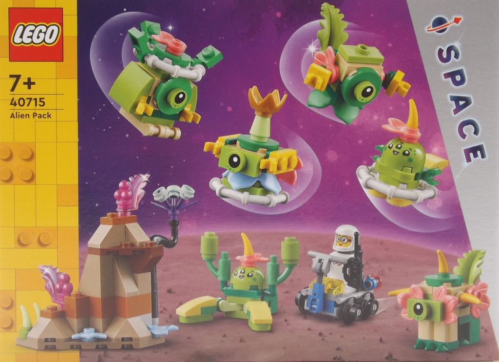 The image shows the packaging of a LEGO set with various alien figures and a small landscape.