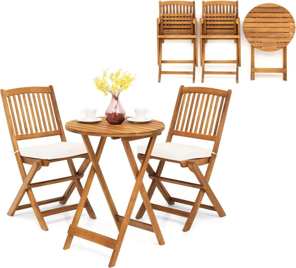 A wooden bistro set with two chairs and a table, set against a white background. The chairs have beige cushions, and the table has two cups and a vase with yellow flowers.