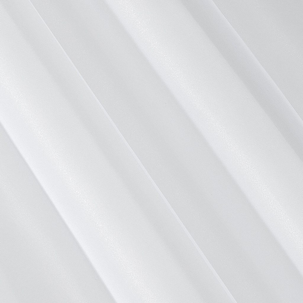 A close-up view of white pleated fabric, likely a curtain or textile.
