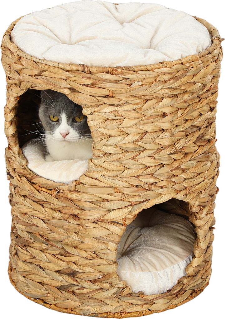 A cat tower made of woven material with two openings and a cushion on top. A cat is visible in one of the openings.