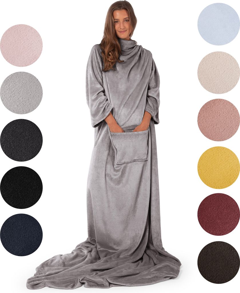 A woman wearing a grey blanket with sleeves, standing in front of a white background. Several circular swatches of different colored blankets are displayed to the left and right of the woman.