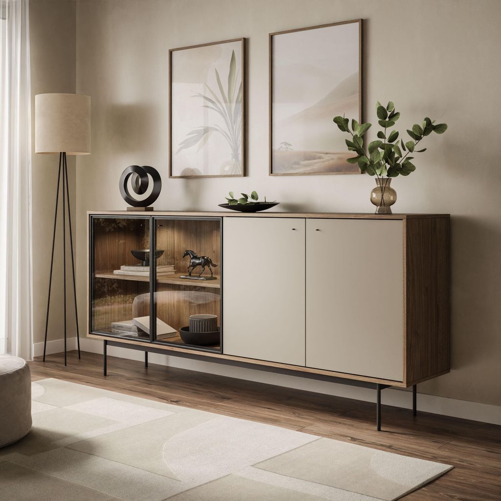 A modern living room setting with a sideboard, artwork, and a floor lamp.