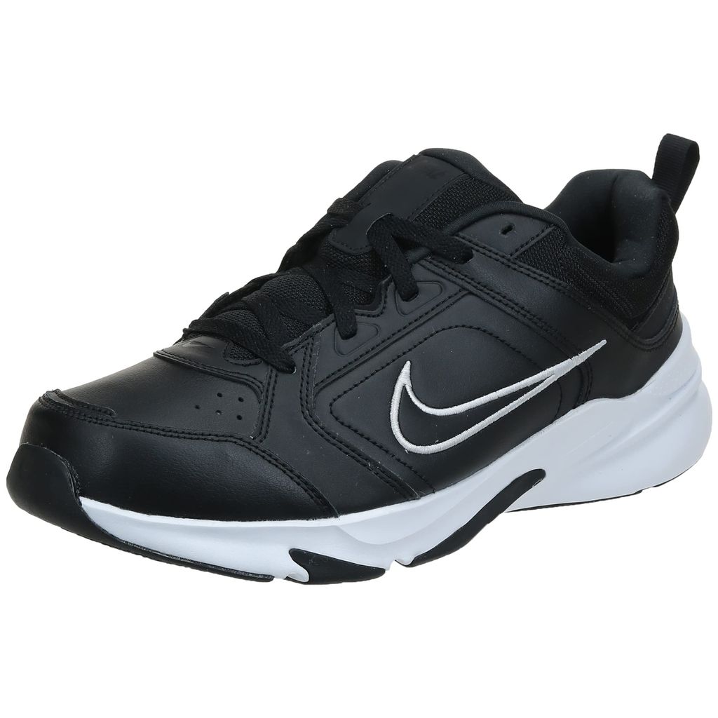 A black Nike shoe with a white sole and white Nike swoosh logo.