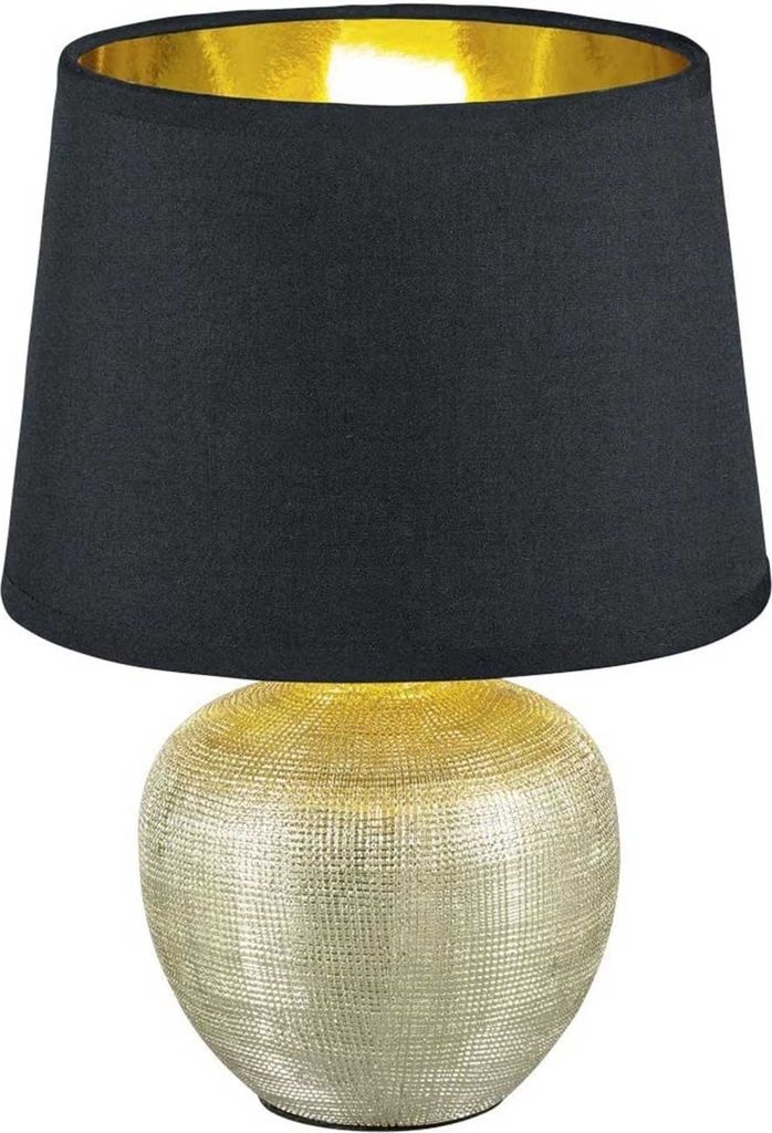 A table lamp with a black shade and a textured gold base.