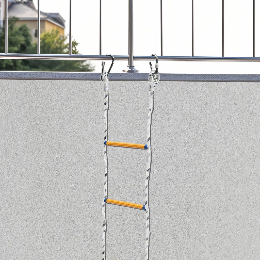 A rope ladder is hanging from a balcony railing, with the wall of the building in the background.