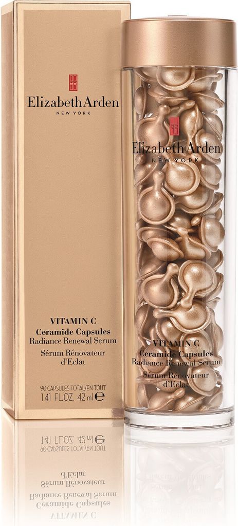A bottle of Elizabeth Arden Vitamin C Ceramide Capsules next to its packaging.