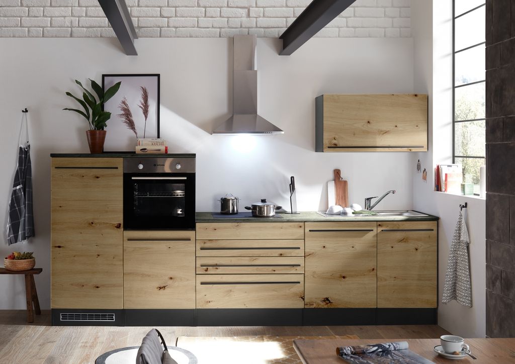 A modern kitchen setup with wooden cabinets and stainless steel appliances.